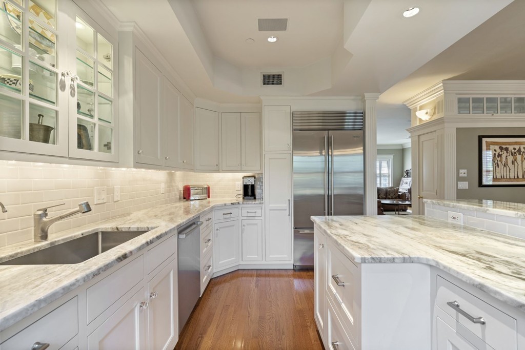 6 Monument Square, Unit 4 Boston, MA 02129 - Photo 3 of 37 a kitchen with a sink and cabinets