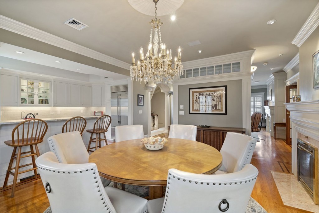 6 Monument Square, Unit 4 Boston, MA 02129 - Photo 6 of 37 a dining room with furniture and chandelier