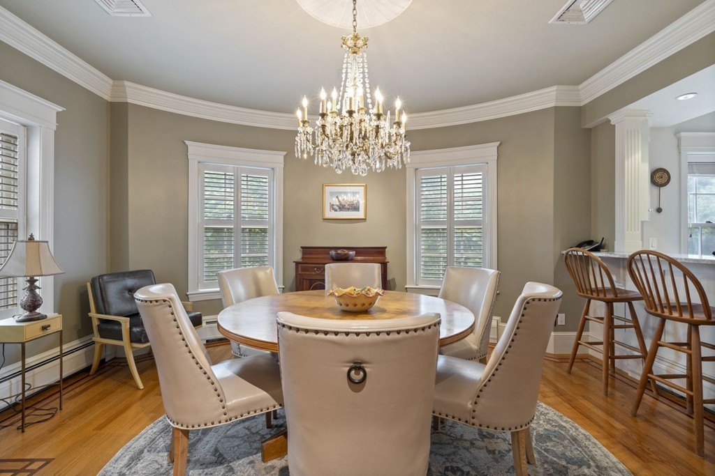 6 Monument Square, Unit 4 Boston, MA 02129 - Photo 7 of 37 a dining room with furniture a chandelier and window