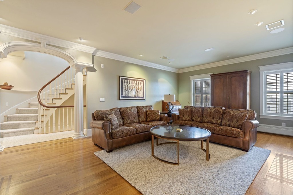 6 Monument Square, Unit 4 Boston, MA 02129 - Photo 9 of 37 a living room with furniture and a large window
