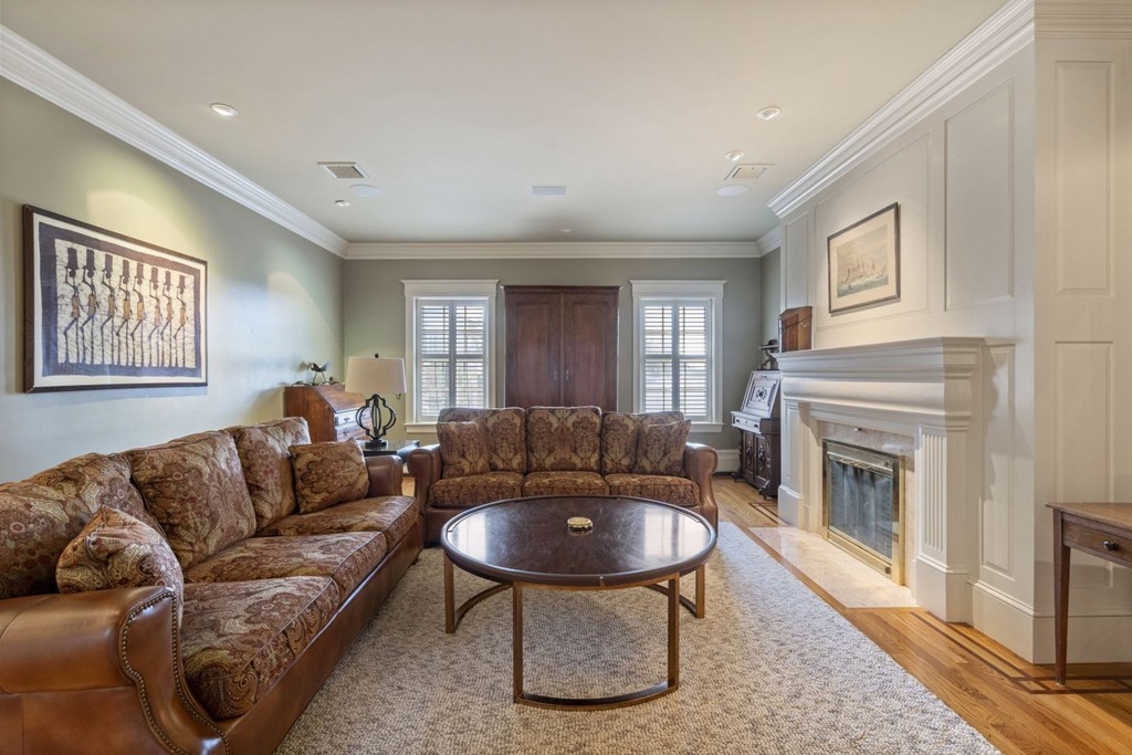 6 Monument Square, Unit 4 Boston, MA 02129 - Photo 10 of 37 a living room with furniture and a fireplace