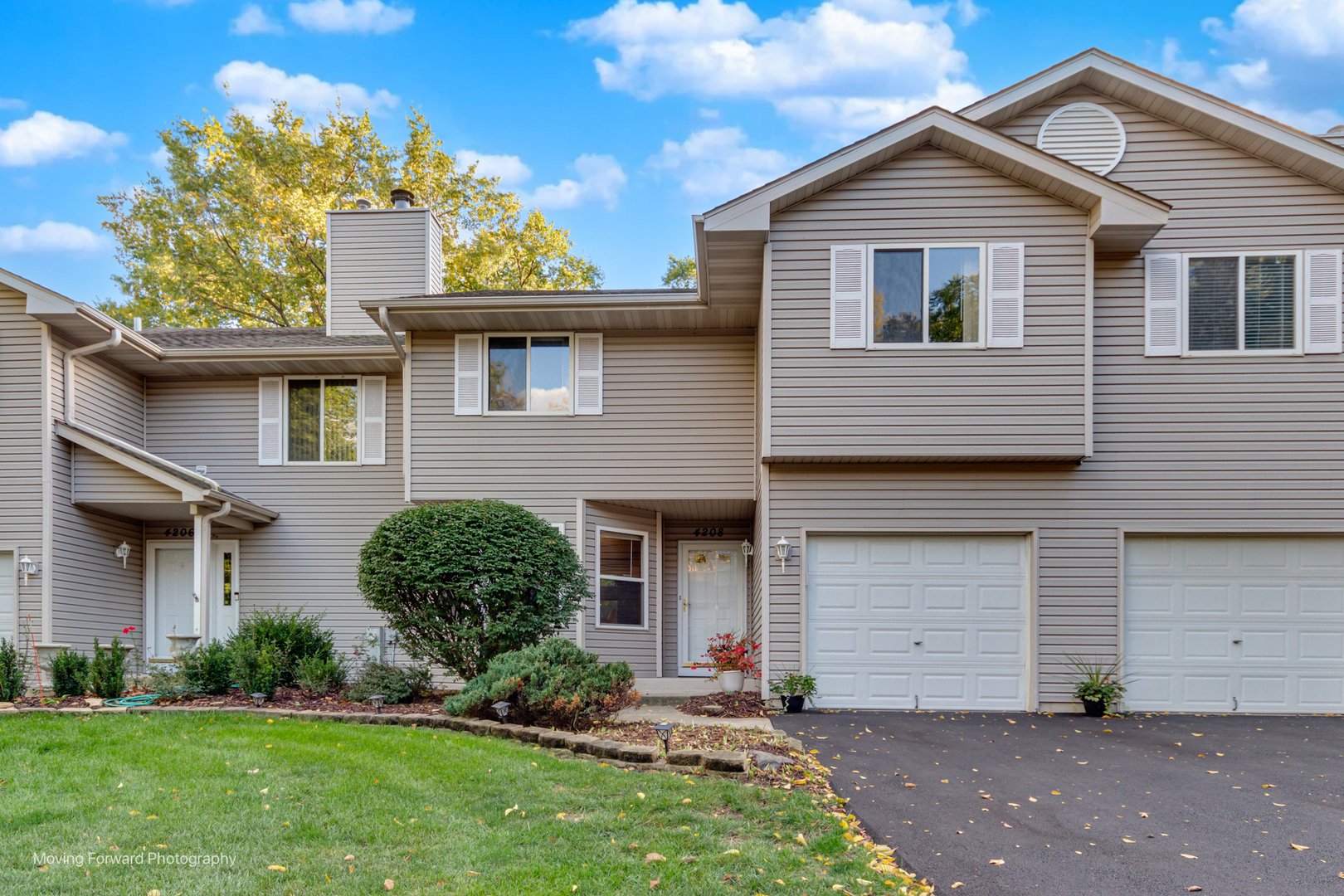4208 Whitetail Court Joliet, IL 60431 - Photo 2 of 33 a front view of a house with a garden and plants