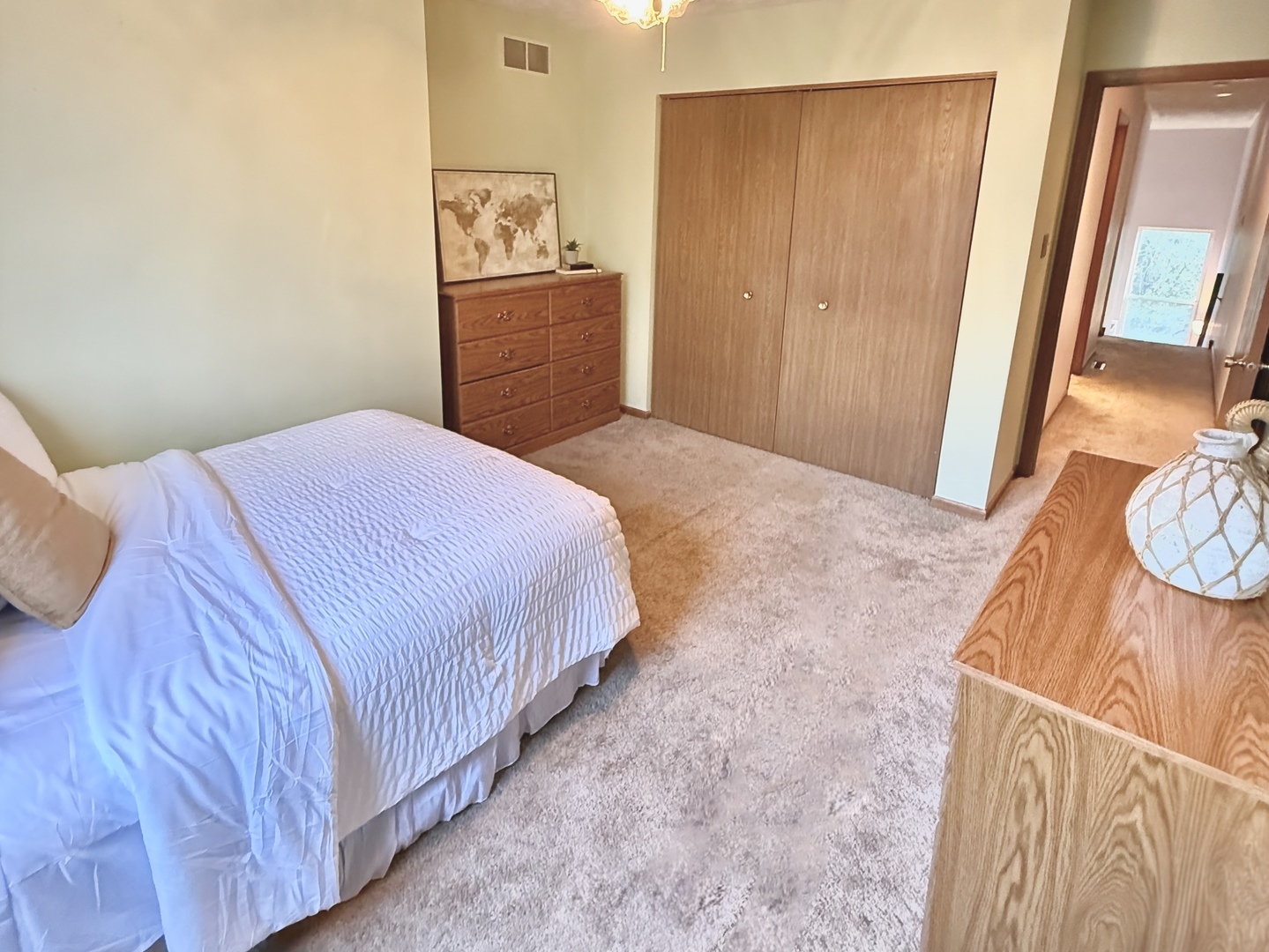 4208 Whitetail Court Joliet, IL 60431 - Photo 24 of 33 a bedroom with a bed and wooden floor