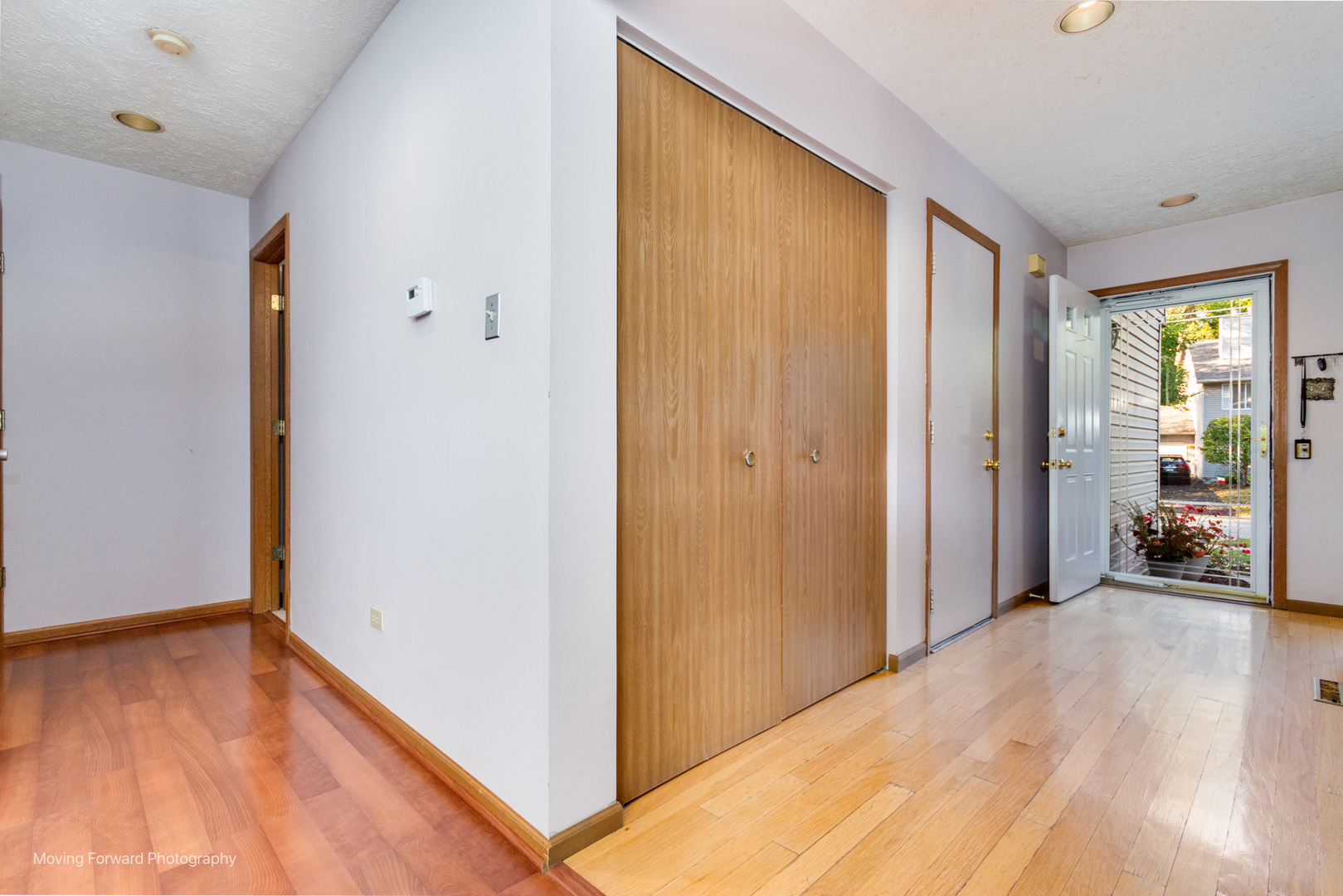 4208 Whitetail Court Joliet, IL 60431 - Photo 4 of 33 a view of a livingroom with wooden floor and a bedroom