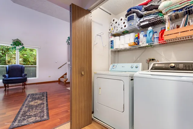 a view of storage and utility room with washer and dryer