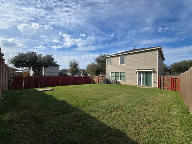 a view of a backyard of the house