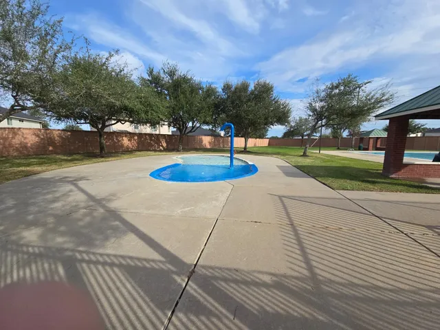 a view of a swimming pool with an outdoor space and seating area