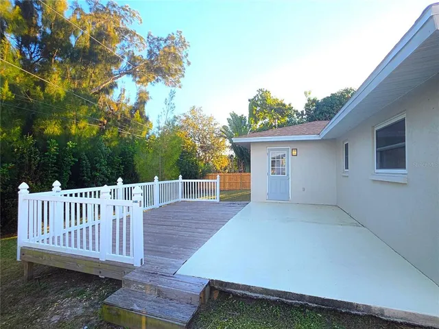 a view of a deck with a backyard