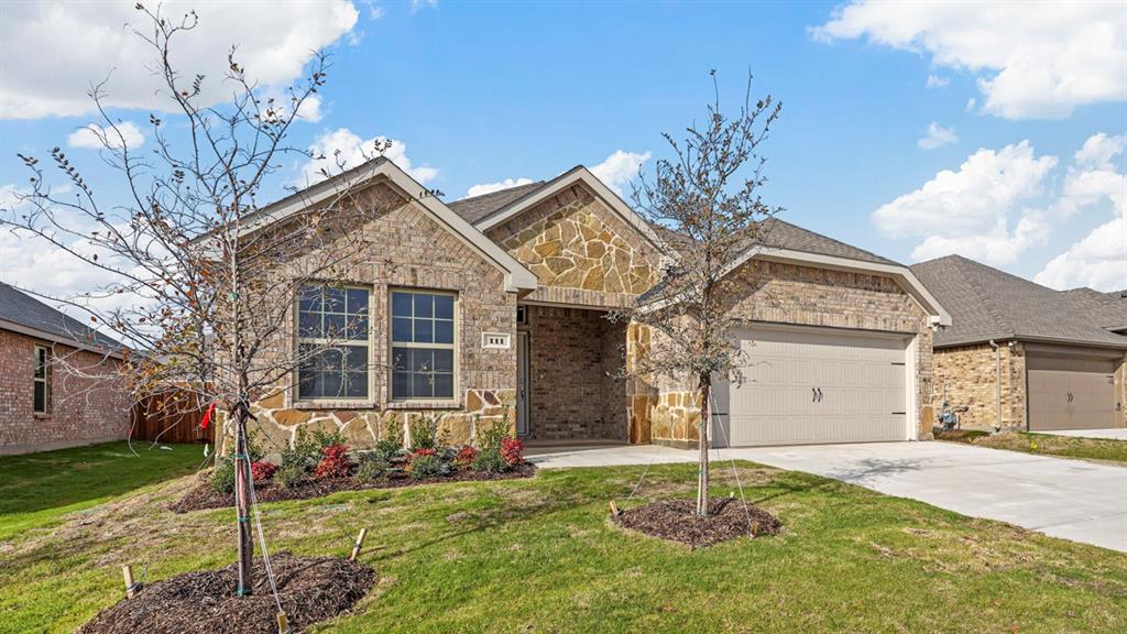 a house that has a tree in front of the house