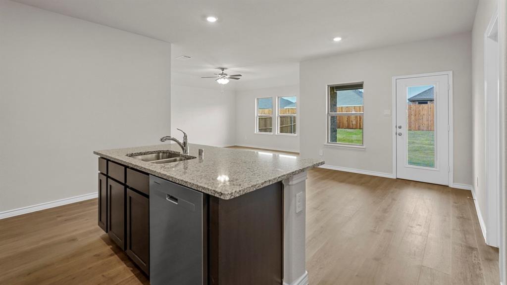 111 Lantern Road Caddo Mills, TX 75135 - Photo 13 of 40 an empty room with wooden floor and windows