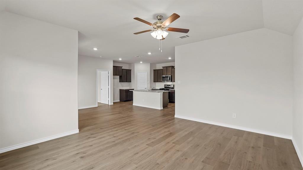 111 Lantern Road Caddo Mills, TX 75135 - Photo 14 of 40 a view of an empty room with a kitchen