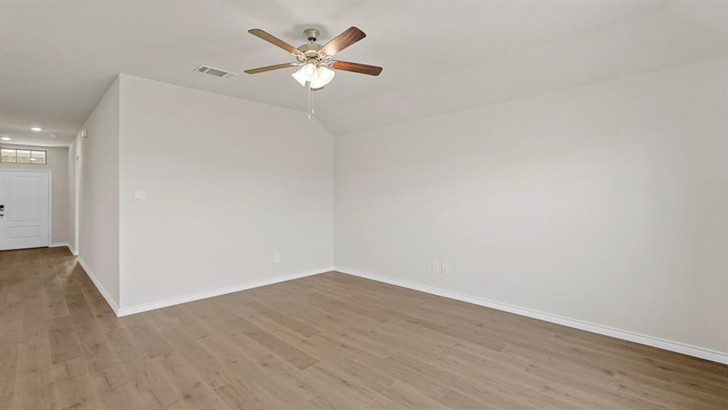 111 Lantern Road Caddo Mills, TX 75135 - Photo 16 of 40 an empty room with wooden floor and window