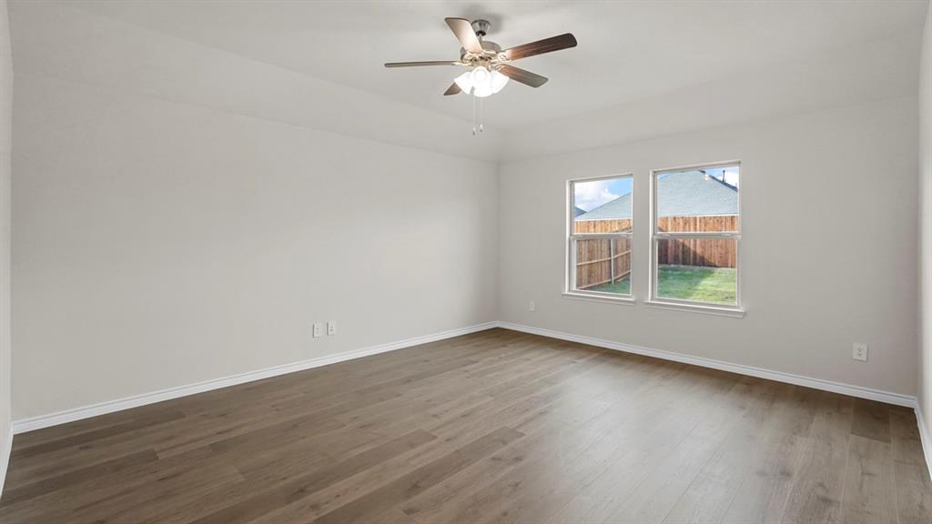 111 Lantern Road Caddo Mills, TX 75135 - Photo 17 of 40 wooden floor in an empty room with a window