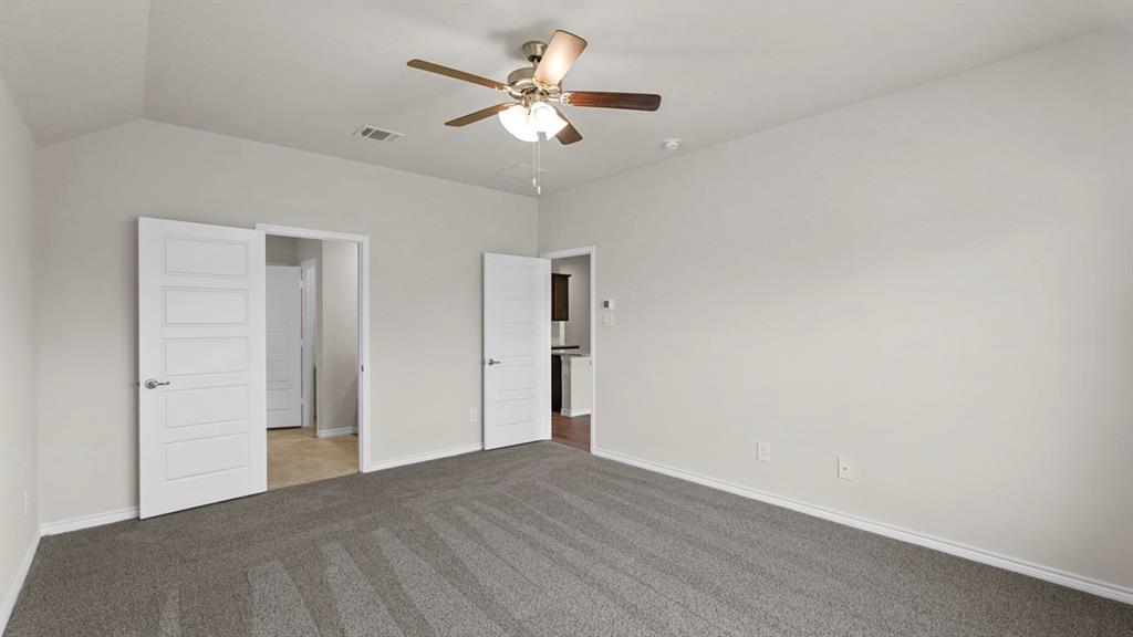 111 Lantern Road Caddo Mills, TX 75135 - Photo 20 of 40 a view of a big room with wooden floor and a chandelier fan