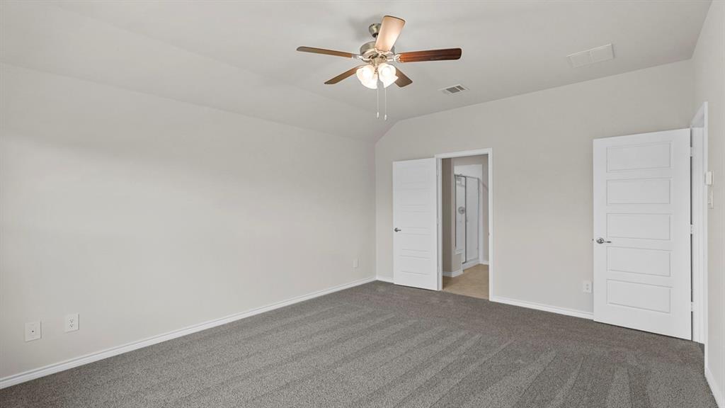 111 Lantern Road Caddo Mills, TX 75135 - Photo 22 of 40 a view of a room with a ceiling fan and wooden floor