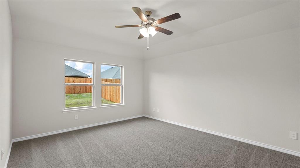 111 Lantern Road Caddo Mills, TX 75135 - Photo 23 of 40 an empty room with a window and a fan