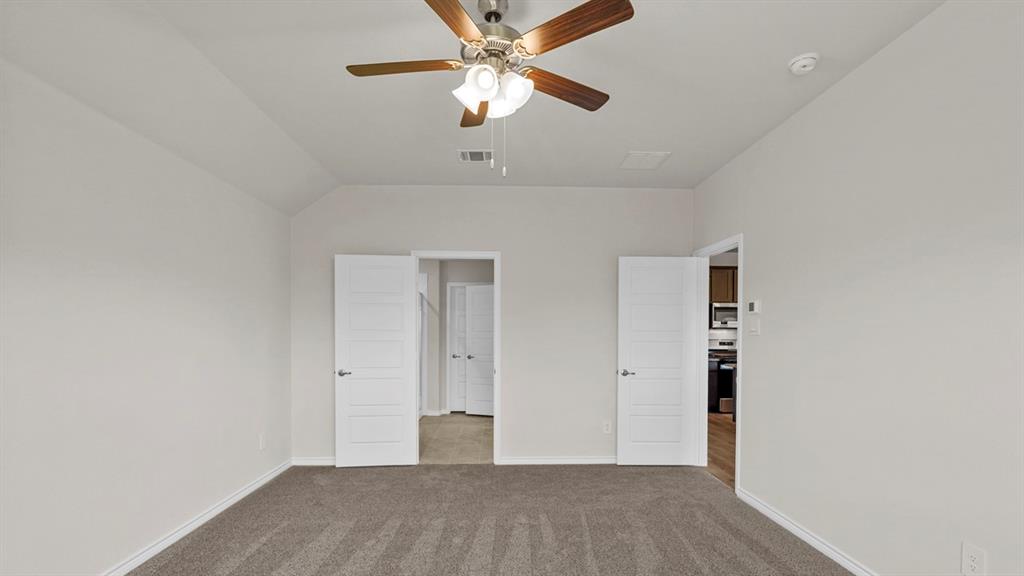 111 Lantern Road Caddo Mills, TX 75135 - Photo 25 of 40 an empty room with closet and a ceiling fan