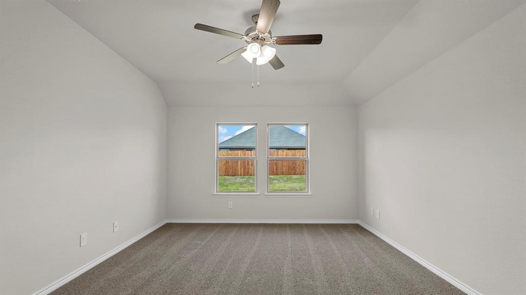 111 Lantern Road Caddo Mills, TX 75135 - Photo 31 of 40 an empty room with a window and a fan
