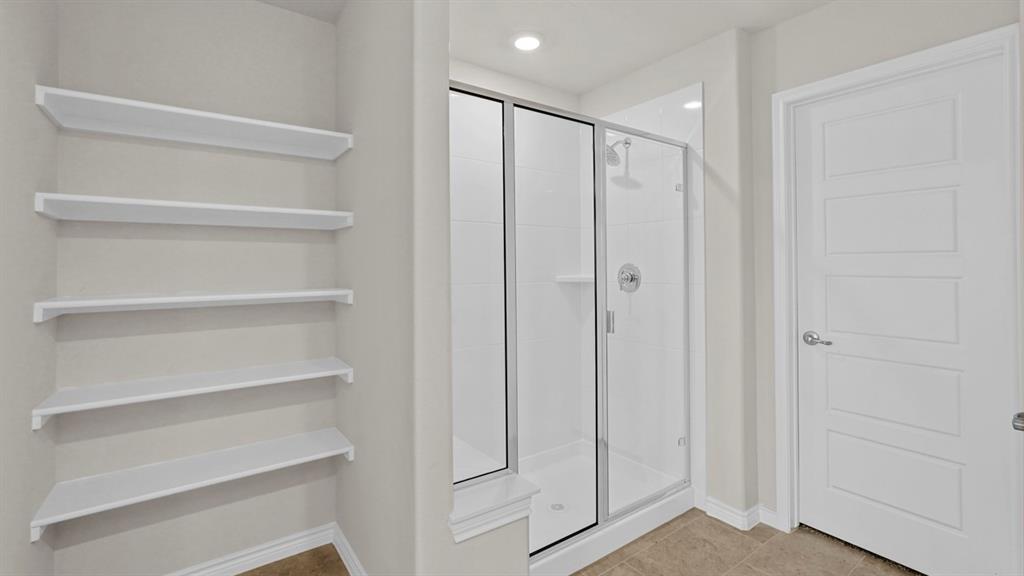 111 Lantern Road Caddo Mills, TX 75135 - Photo 33 of 40 a view of walk in closet with empty racks