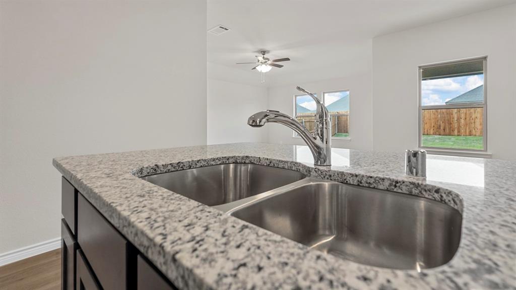 111 Lantern Road Caddo Mills, TX 75135 - Photo 8 of 40 a kitchen with a sink and a bathtub