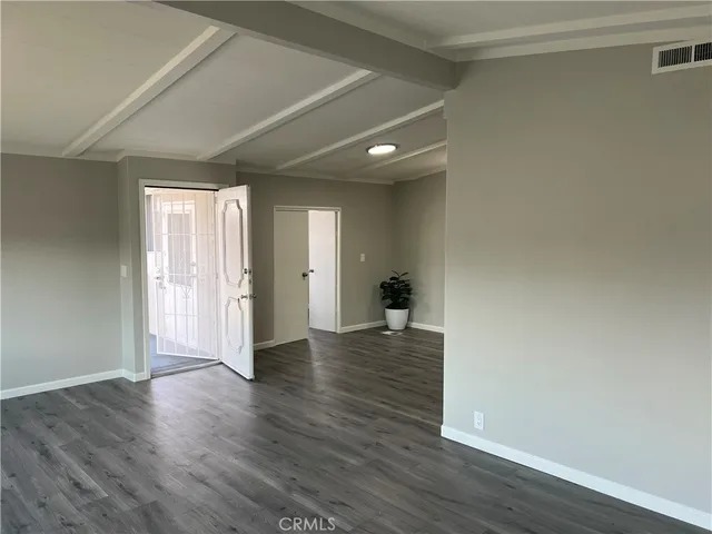 a view of a livingroom with wooden floor