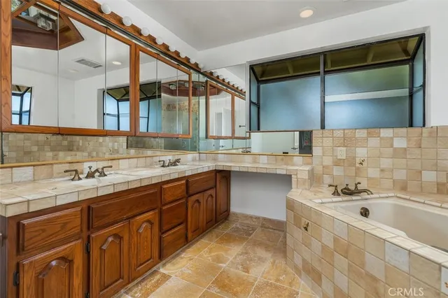 a bathroom with a sink and a bathtub