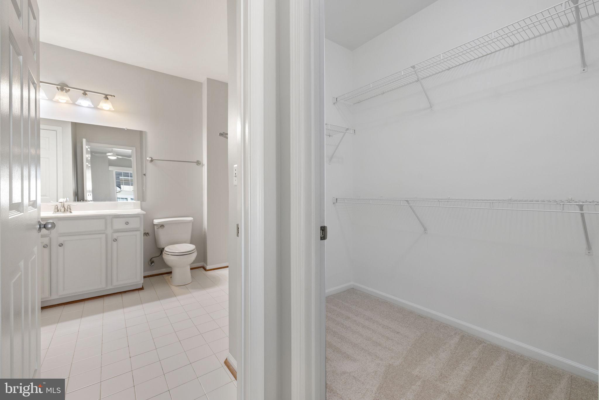 1519 North Point Drive, Unit 302 Reston, VA 20194 - Photo 19 of 33 Primary bath and walk in closet