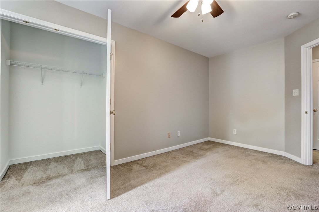 9430 Dunroming Road Chesterfield, VA 23832 - Photo 35 of 40 an empty room with a ceiling fan and a window