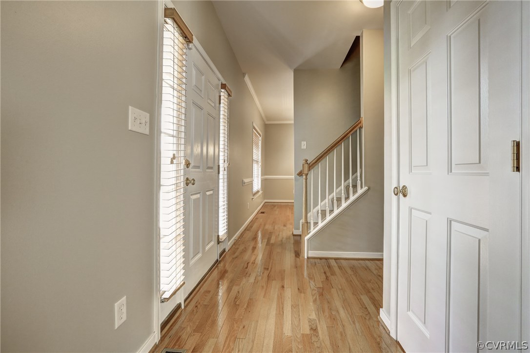 9430 Dunroming Road Chesterfield, VA 23832 - Photo 9 of 40 a view of a hallway with wooden floor and entryway
