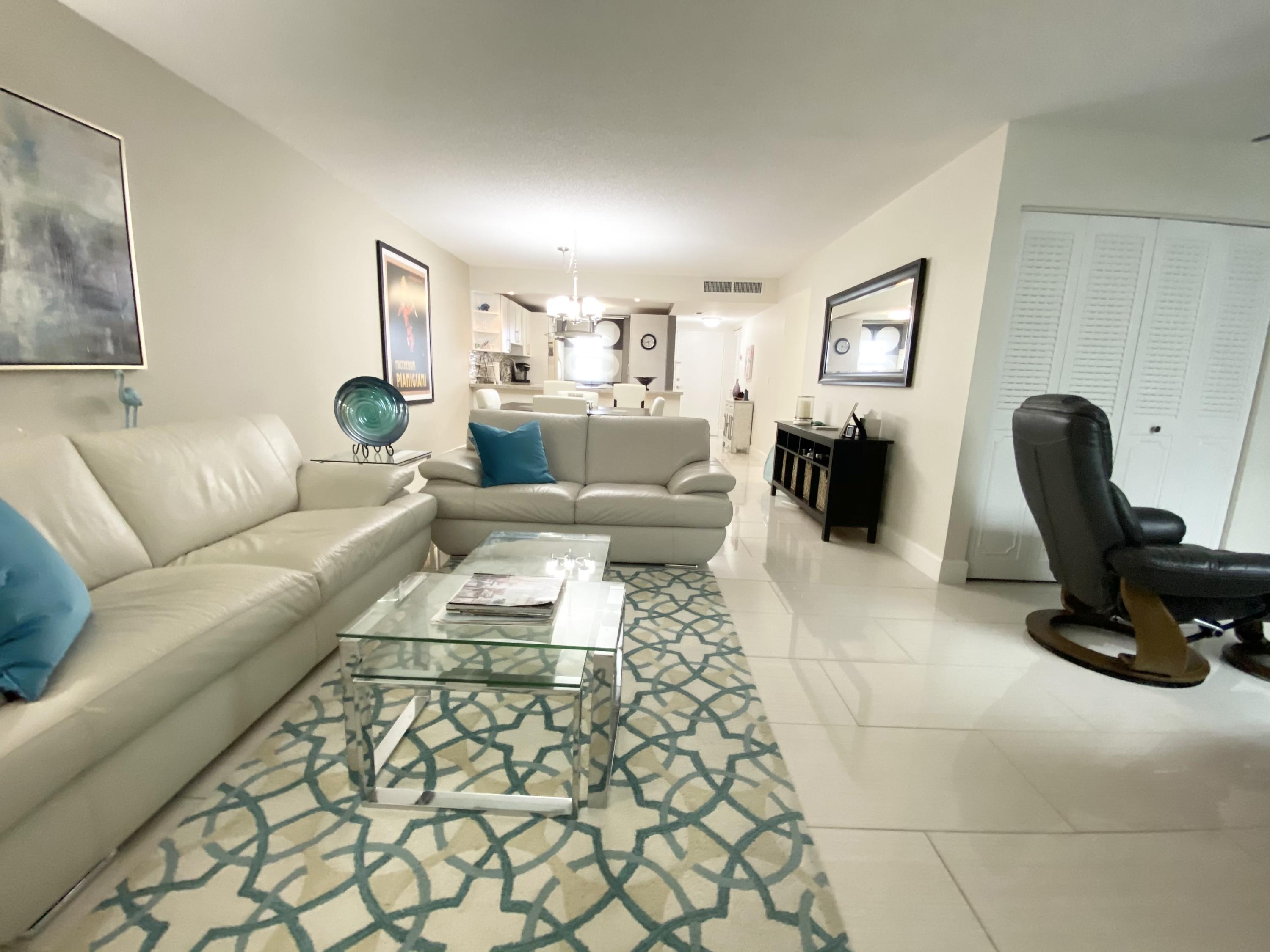 5700 Northwest 2nd Avenue, Unit 702 Boca Raton, FL 33487 - Photo 8 of 28 living room/dining room