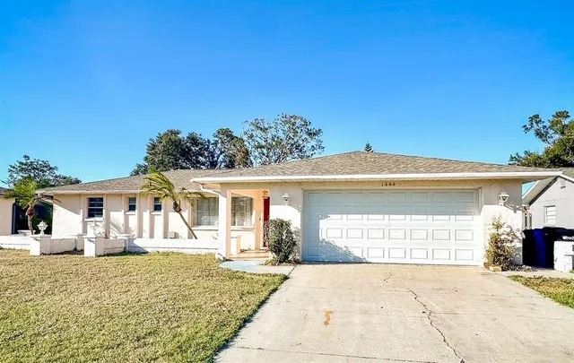 a front view of a house with a garage