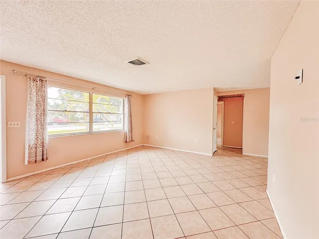 a view of an empty room with window