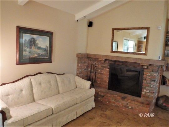 601 North Sierra View Street Ridgecrest, CA 93555 - Photo 13 of 35 a living room with furniture and a fireplace