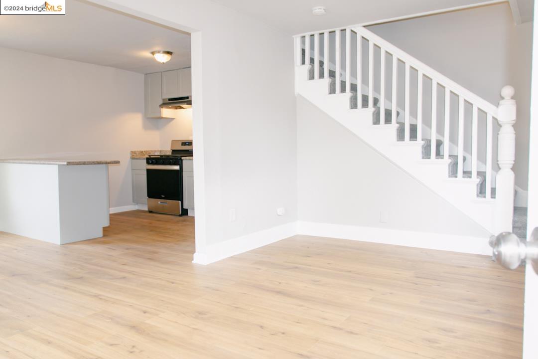1173 12th Street Oakland, CA 94607 - Photo 5 of 21 a view of entryway and hall with wooden floor