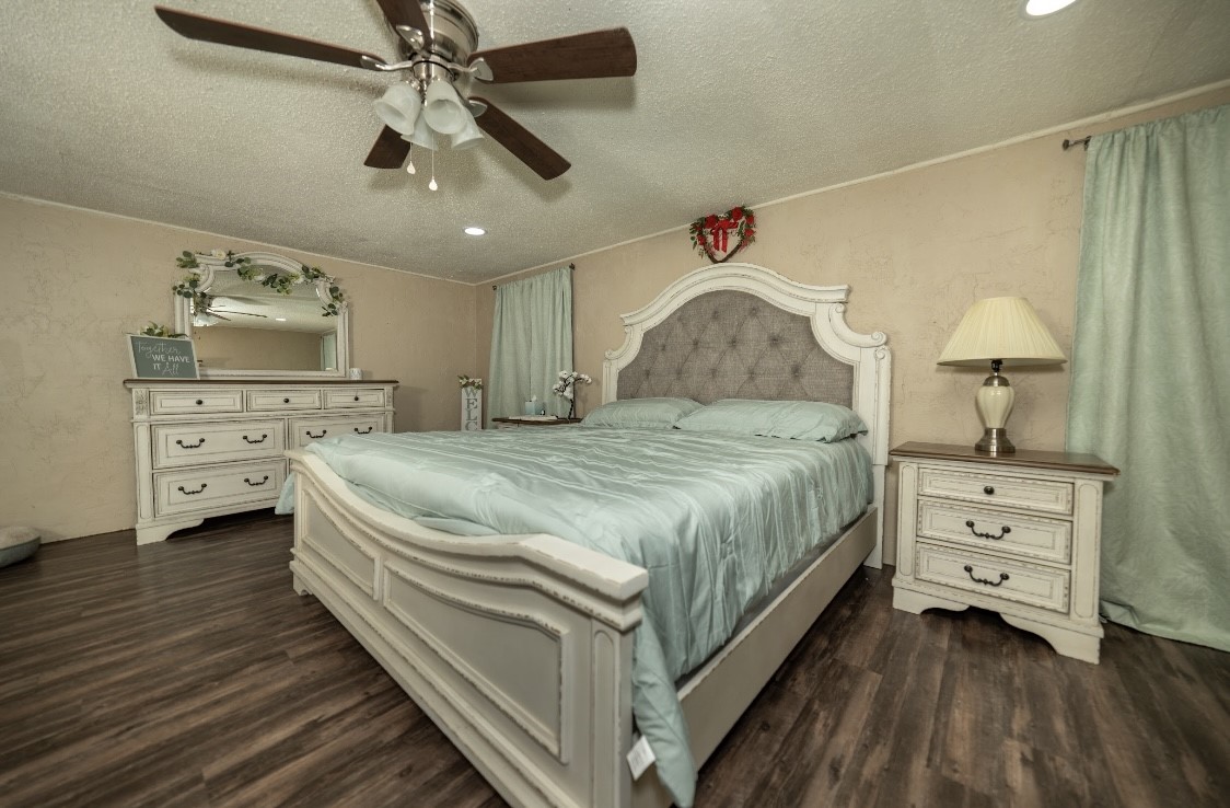 134 Briargrove Road Crockett, TX 75835 - Photo 12 of 24 a spacious bedroom with a bed and a dresser