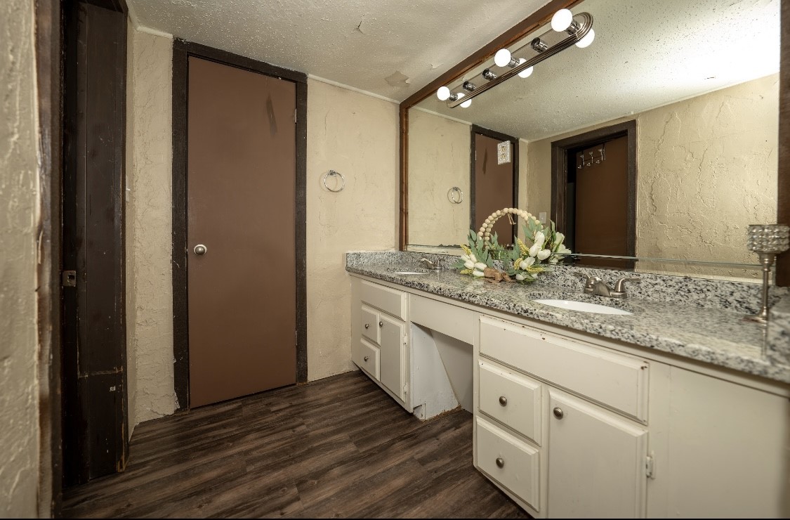 134 Briargrove Road Crockett, TX 75835 - Photo 14 of 24 a bathroom with a double vanity sink and a mirror