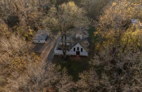 an aerial view of house with yard