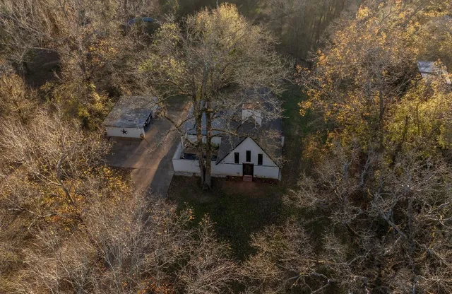 an aerial view of house with yard