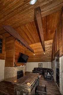 a view of a chairs and table on the roof deck