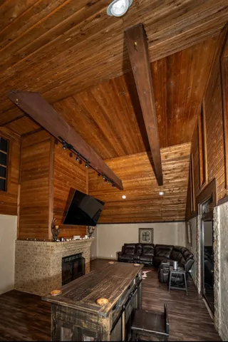a view of a chairs and table on the roof deck