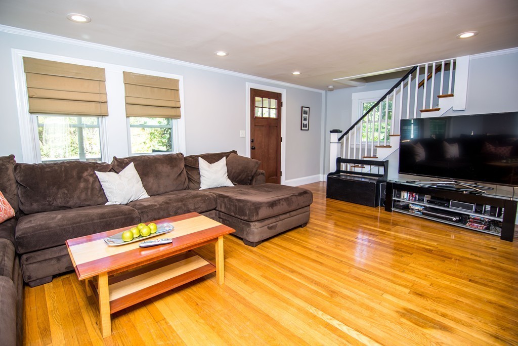 251 Beaver Dam Road Scituate, MA 02066 - Photo 11 of 23 a living room with furniture and a flat screen tv