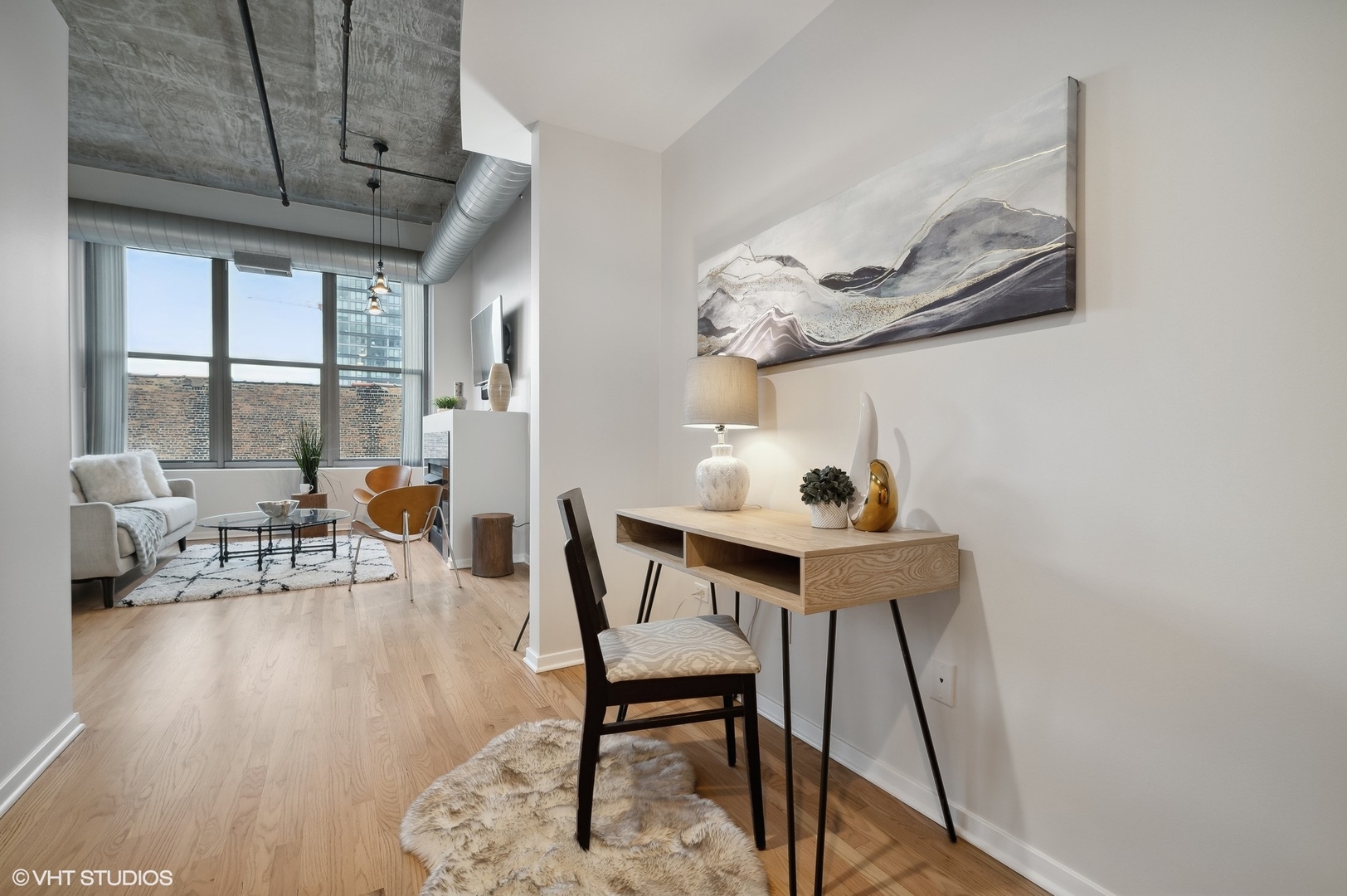 933 West Van Buren Street, Unit 917 Chicago, IL 60607 - Photo 13 of 24 a dining room with furniture and wooden floor