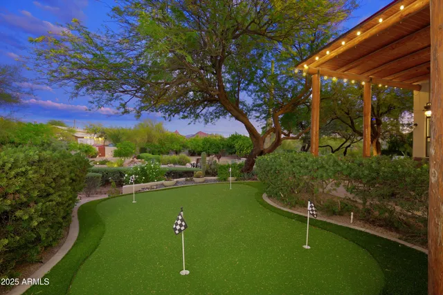 a view of a golf course with a lake view