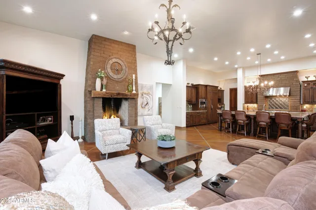 a living room with fireplace furniture and a flat screen tv