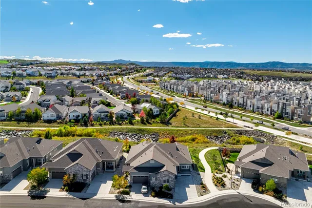 an aerial view of a house with a swimming pool