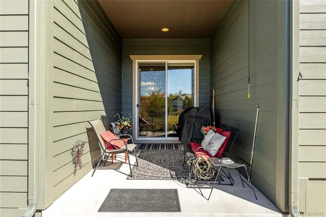 a bench sitting in front of a door