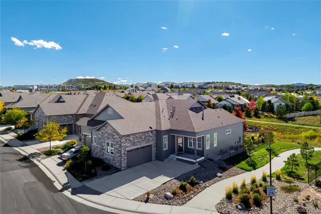 an aerial view of a house with a garden