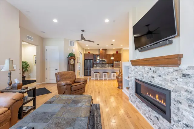 a living room with furniture and flat screen tv