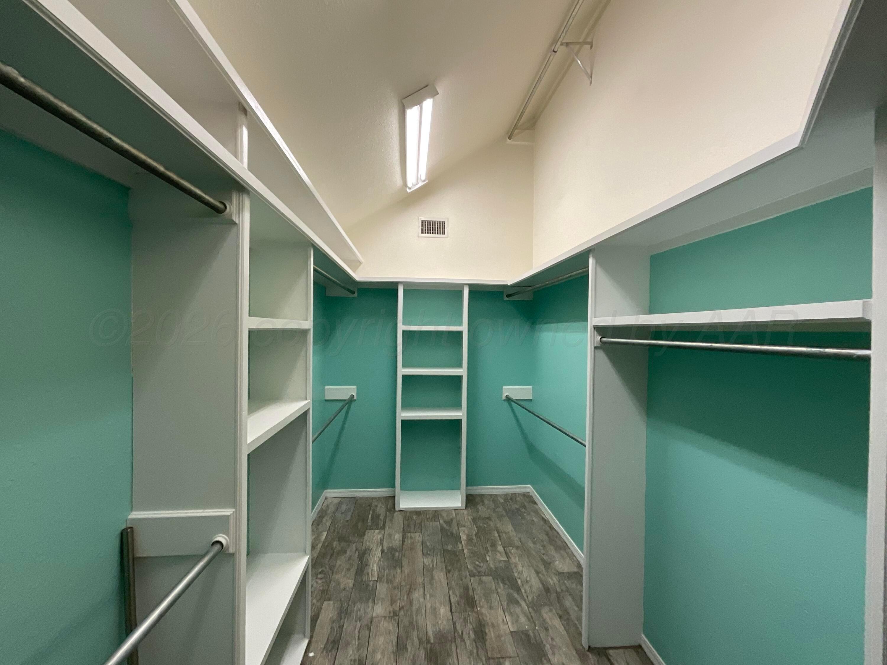 8101 Sheldon Road Amarillo, TX 79119 - Photo 11 of 20 a view of room with cabinets and stairs