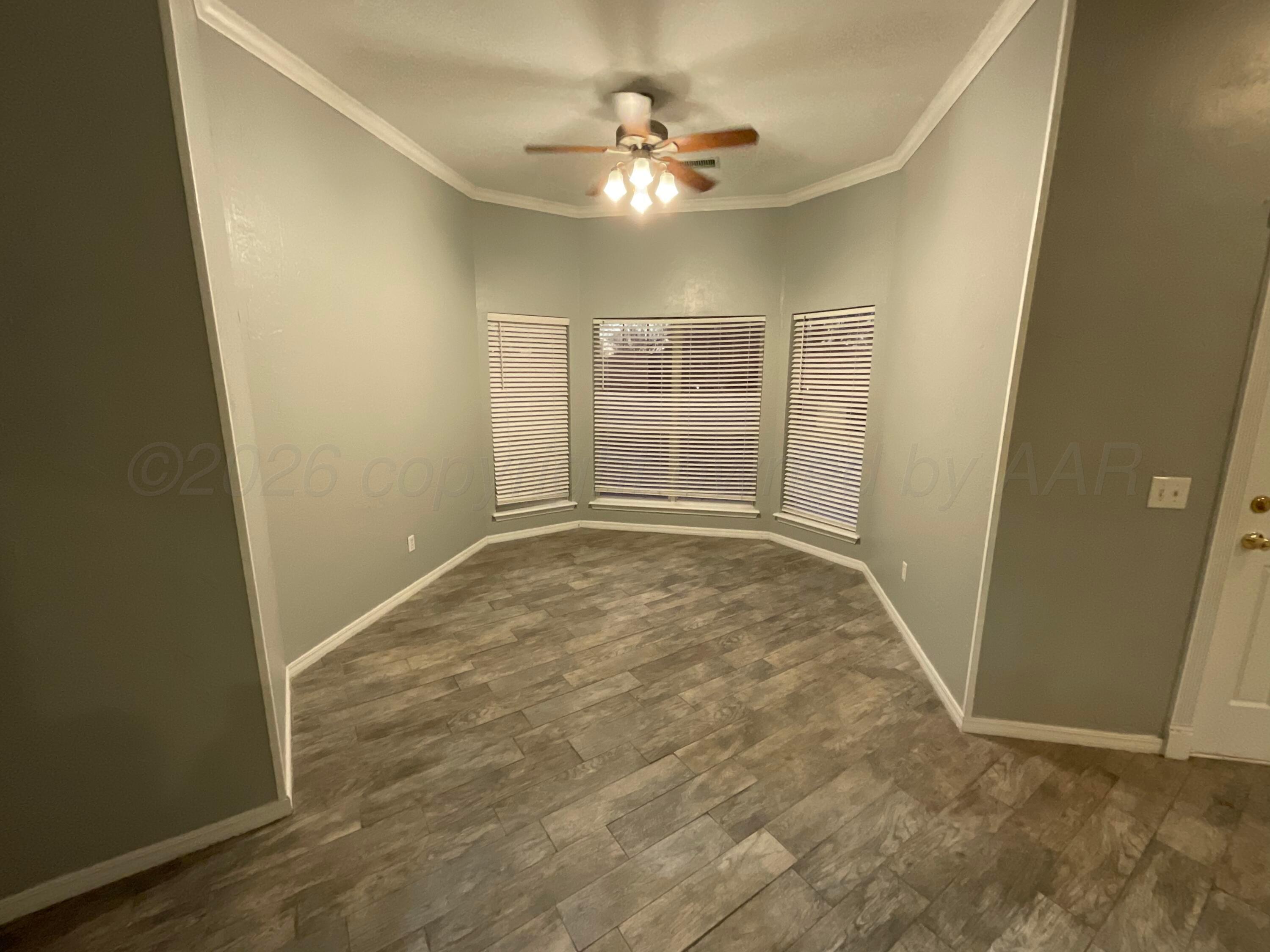 8101 Sheldon Road Amarillo, TX 79119 - Photo 20 of 20 an empty room with closet and a ceiling fan